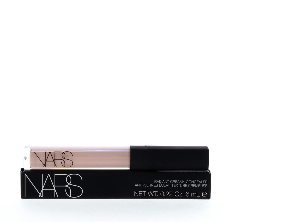 NARS concealer beside common items showing compact size and travel-friendly benefit