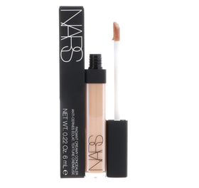 NARS concealer beside a coin illustrating compact 0.22 oz size and travel-friendliness