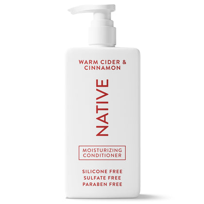 Native conditioner front bottle shows warm cider cinnamon scent and clean formula benefit
