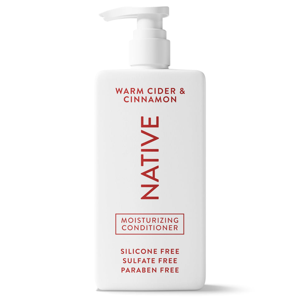 Native conditioner front bottle shows warm cider cinnamon scent and clean formula benefit