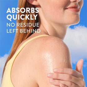 Native sunscreen bottle on a beach towel evoking reef-safe travel readiness