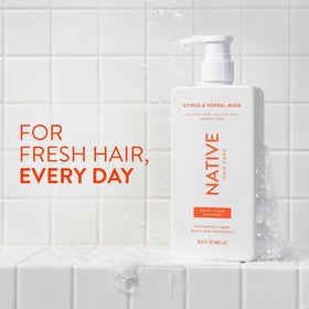 Native shampoo bottle closeup highlighting label and easy-pour cap benefit