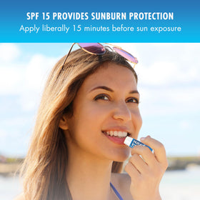 Natural Ice lip balm being applied outdoors for sun and wind protection