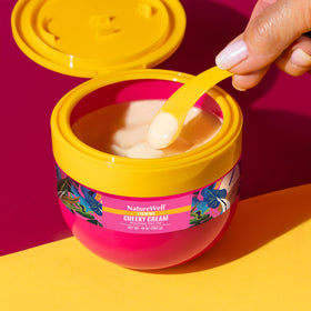 NATURE WELL jar inside beach tote illustrating travel-friendly, sun-ready body care benefit