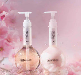 NatureLab.TOKYO bottle next to hand showing true 11.5 fl oz scale