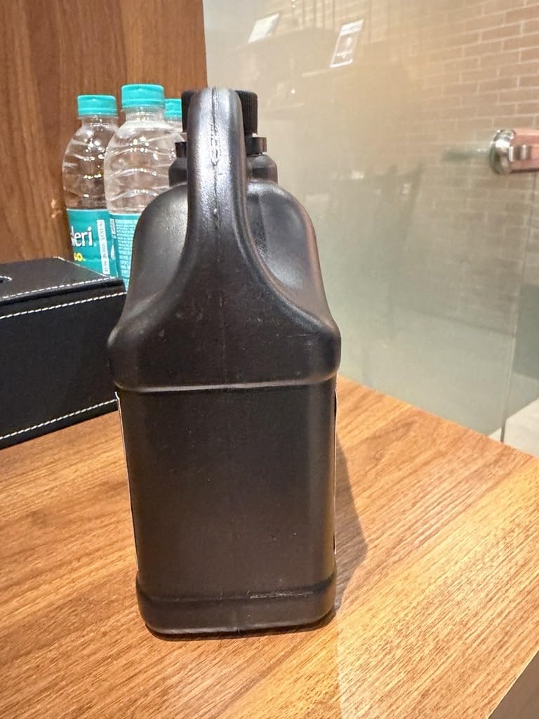 Naturevibe Botanicals bottle next to ruler showing 32 oz scale
