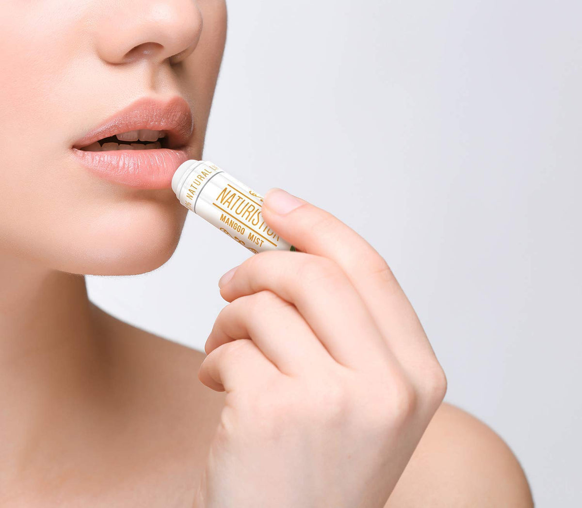 Naturistick open tube close-up displaying creamy beeswax texture for smooth application