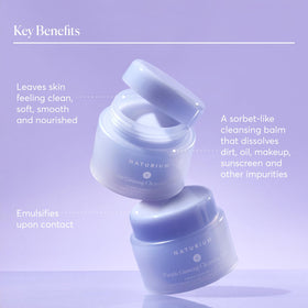 Naturium balm melting on fingers demonstrating effortless makeup breakdown