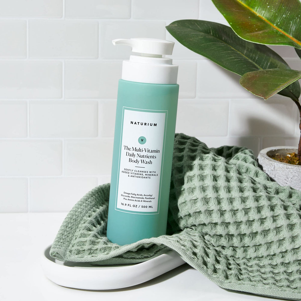 Naturium bottle on bathroom shelf styled for everyday routine benefit