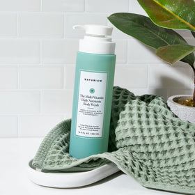 Naturium bottle on bathroom shelf styled for everyday routine benefit