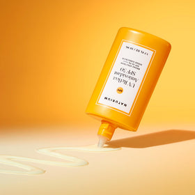 Naturium bottle beside SPF info highlighting broad-spectrum protection