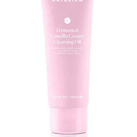 Naturium Cleansing Oil on bathroom shelf in lifestyle scene for travel and routine benefit