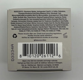 Naturium lip mask beside bedtime items to show overnight use benefit