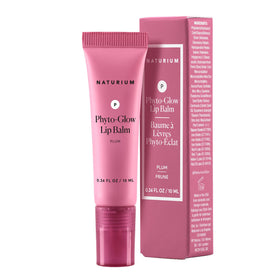 Naturium Phyto-Glow beside a hand for size comparison, travel-friendly and portable