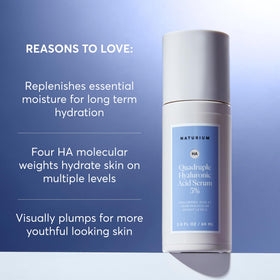 Naturium serum being dispensed onto fingertip demonstrating easy application and precise dosing