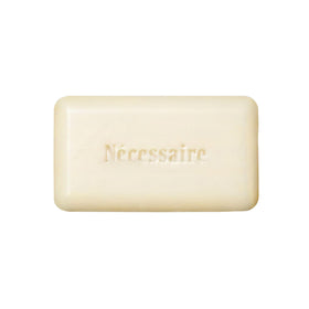 Nécessaire front packaging of the exfoliant bar highlighting fragrance-free benefit