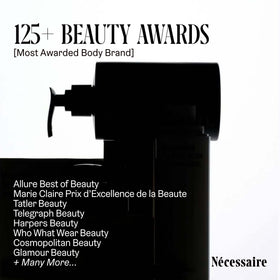 Nécessaire applying lotion on forearm illustrating smooth absorption and hydration