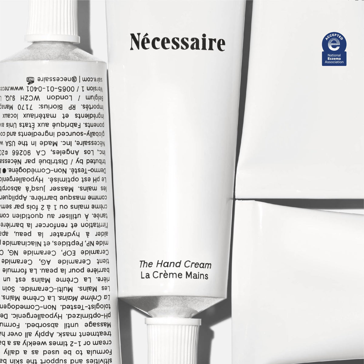 Nécessaire hand cream being applied from tube demonstrating quick application benefit