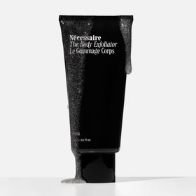 Nécessaire volcanic pumice texture close-up conveying effective physical exfoliation
