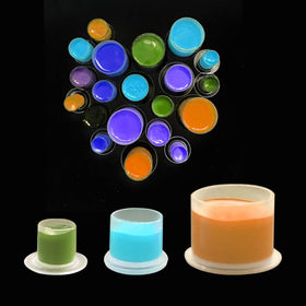 Needlehouse caps holding pigment demonstrating color visibility and control