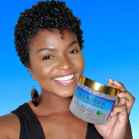 Woman outdoors with defined curls after Nefertiti's Secrets, demonstrates lasting definition