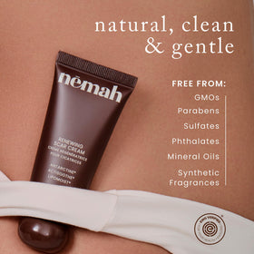 Nemah 1 oz tube beside a coin for size comparison and portability benefit