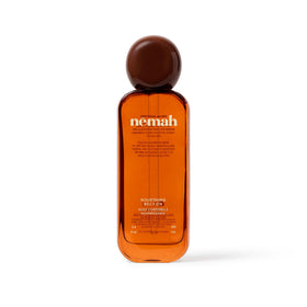 Nemah belly oil front bottle shows clean packaging and quick-dry promise