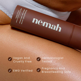 Nemah bottle on bathroom shelf conveying everyday routine convenience and travel-ready size