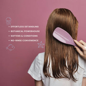 Nemah spray nozzle close-up demonstrating fine mist for even detangling coverage
