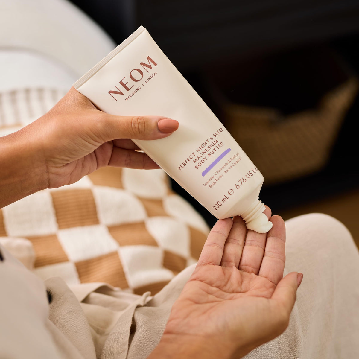 Neom surrounded by lavender, chamomile and patchouli illustrating soothing aroma