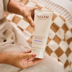 Neom open jar revealing creamy texture for deep skin nourishment