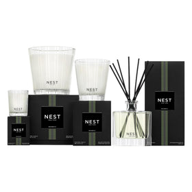 NEST New York bottle held in hand showing 10 fl oz scale and ~300 pumps