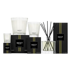 NEST New York bottle staged in a bathroom setting adding uplifting citrus scent ambiance