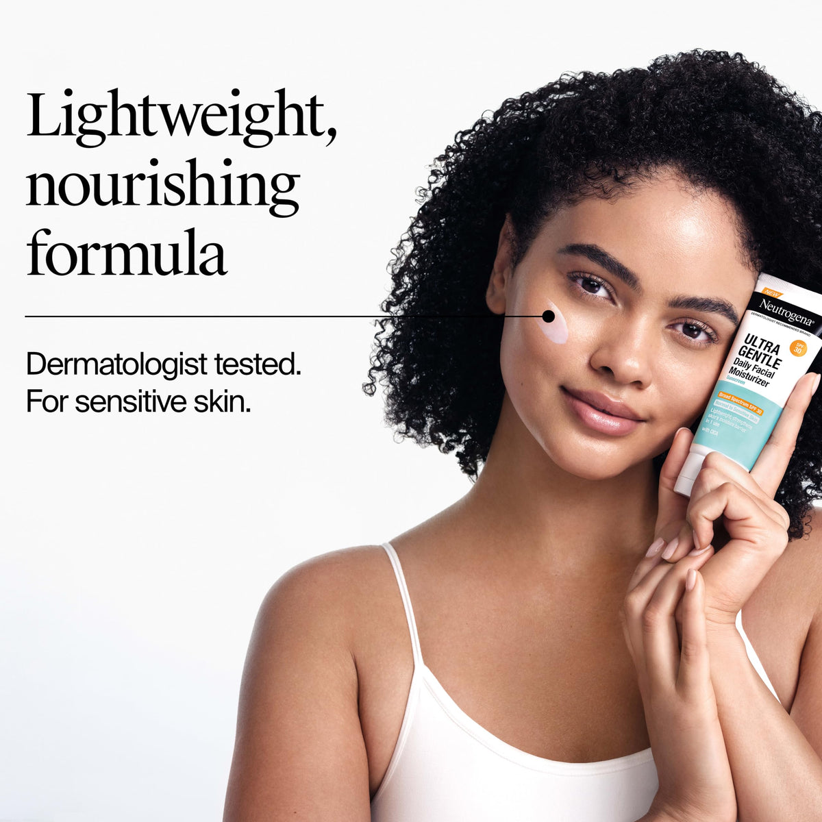 neutrogena bottle in hand showing 3.4 fl oz size for scale and portability