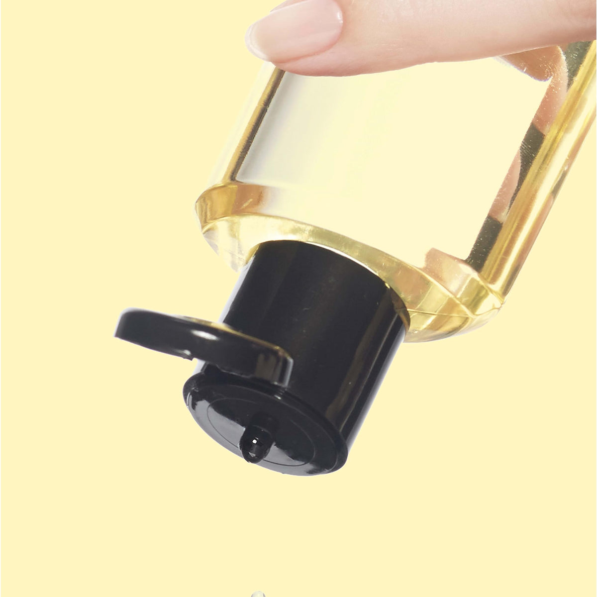 Neutrogena applying oil to damp skin for locked-in moisture and glow