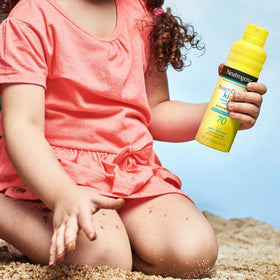 Neutrogena Beach Defense size comparison with a water bottle to show 6.5 oz can portability