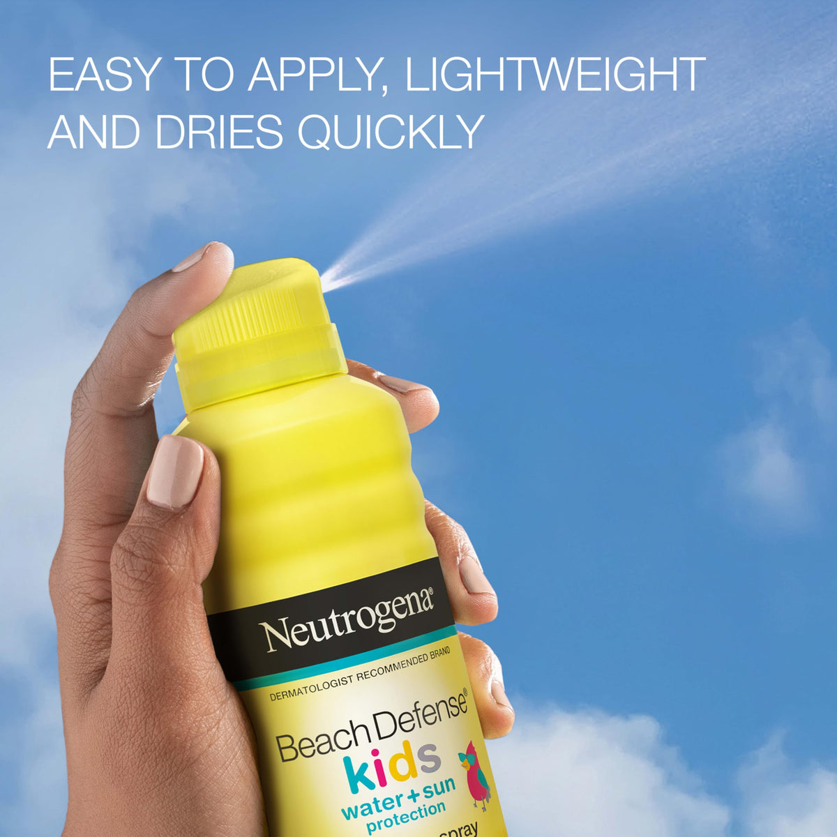 Neutrogena Beach Defense spray in hand demonstrating quick, mess-free application for kids