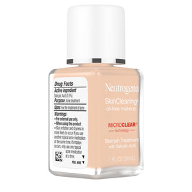 Neutrogena bottle beside skincare items showing routine-friendly acne treatment benefit