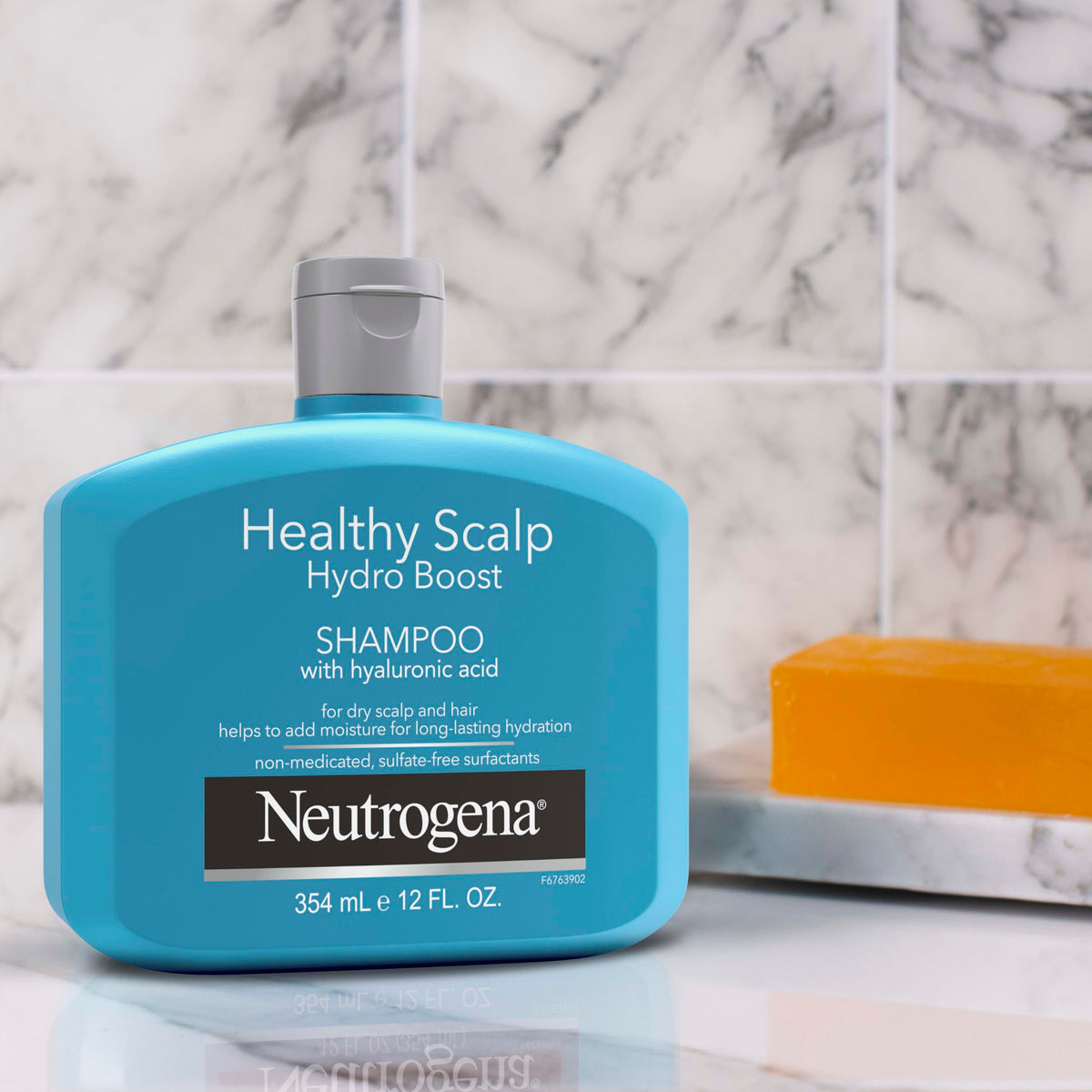 Neutrogena conditioner applied to hair ends showing smoothing benefit