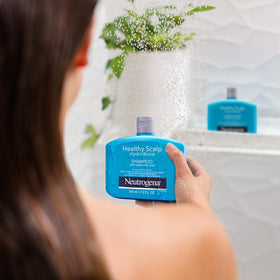 Neutrogena shampoo lather in hand demonstrating gentle cleansing foam