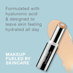 Neutrogena applying stick under-eye to conceal dark circles and hydrate skin