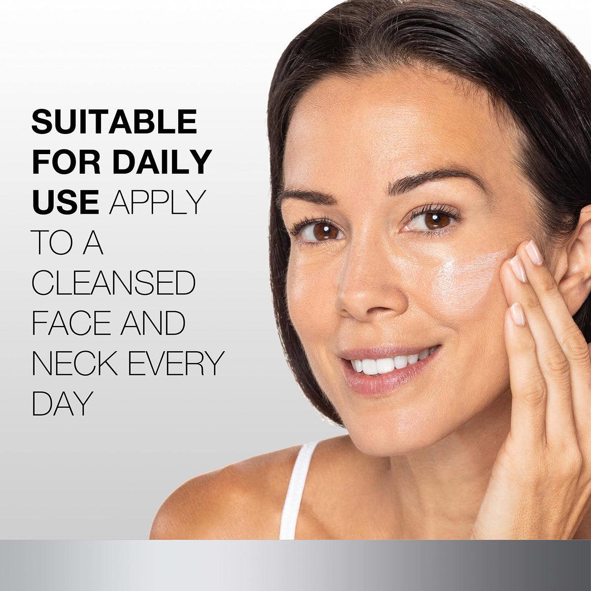Neutrogena moisturizer being applied to cheek showing SPF protection
