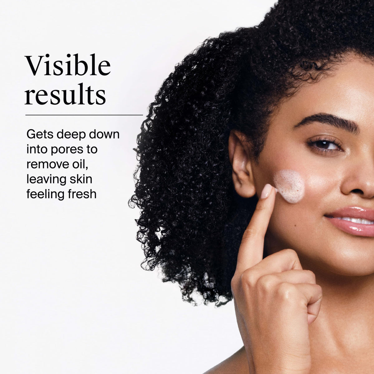 Neutrogena bottle in hand showing actual size and 9.1 fl oz scale
