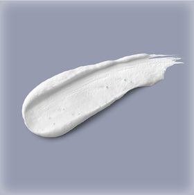 Neutrogena tube next to hand to show 4.2 fl oz size and portability benefit