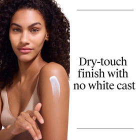 Neutrogena sunscreen being applied at beach showing water-resistant outdoor protection