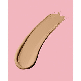 Neutrogena applying concealer under eye demonstrating brightening and crease-free benefit