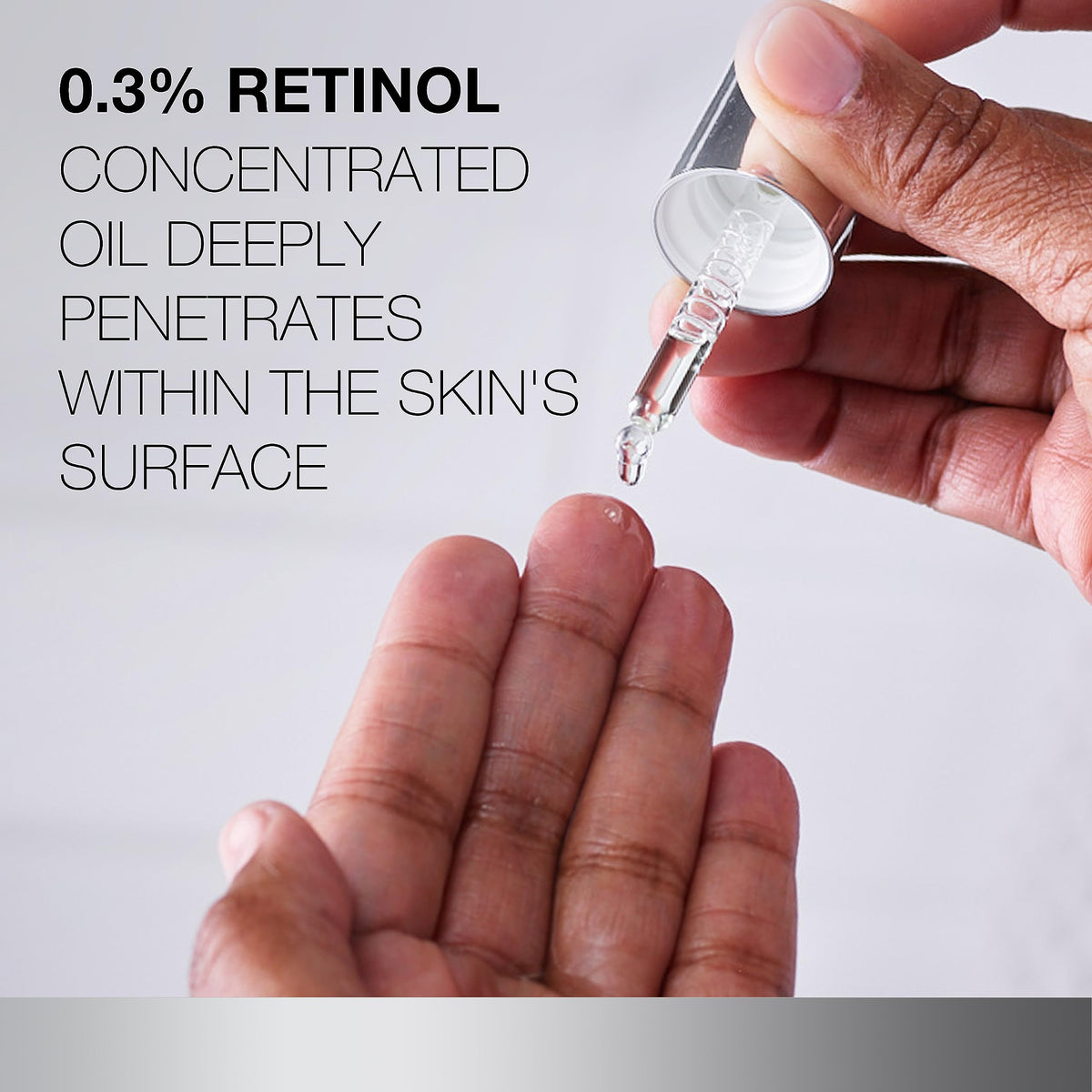 Neutrogena applying a few drops of retinol oil to cheeks for nourishing overnight renewal