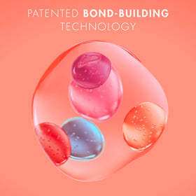 Nexxus 13.5 oz bottle next to common water bottle for scale and sizing