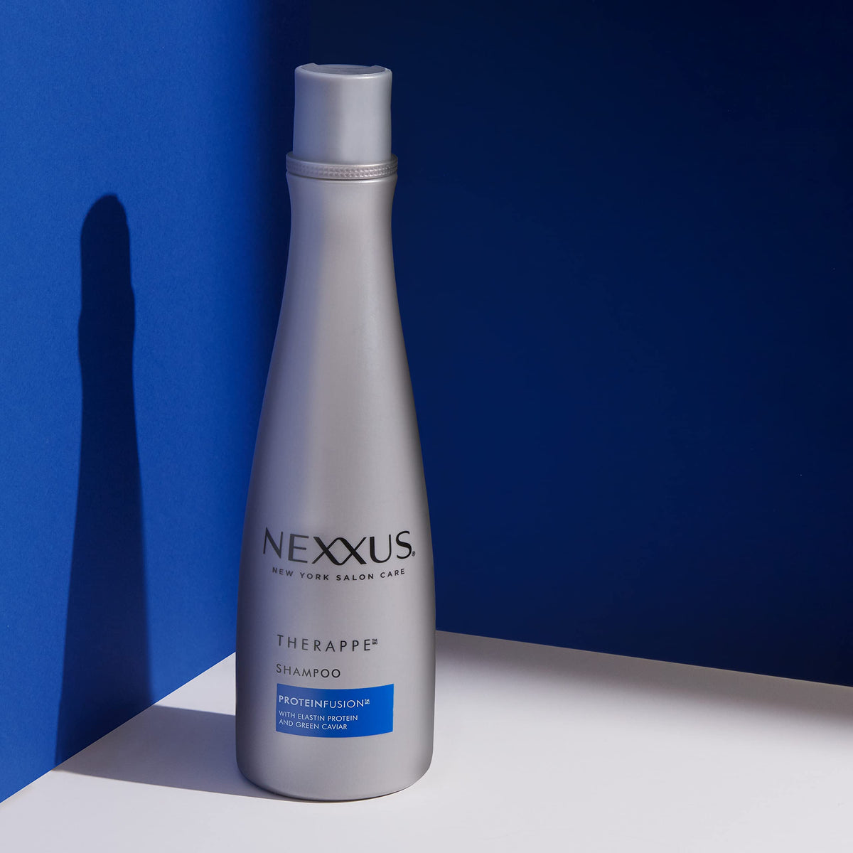 Nexxus bottle label detail showing PROTEINFUSION ingredients benefit