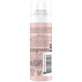 Close-up of Nexxus travel-size cans highlighting compact, TSA-friendly design